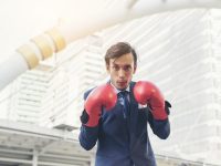 businessman-s-hand-wearing-boxing-gloves_1150-2655 businessman-s-hand-wearing-boxing-gloves_1150-2655